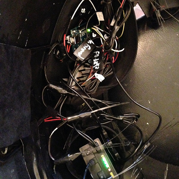 scrying mirror electronics with wiring and battery inside a large rubber bowl