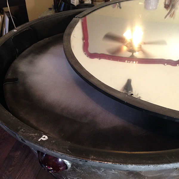 scrying mirror projection screen and 2-way mirror being placed on top of the sculpture