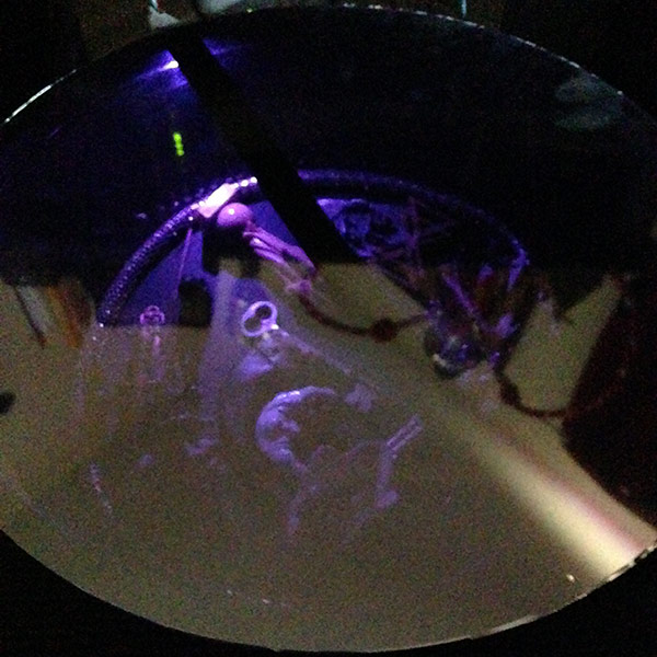 scrying mirror miniature with objects lit by LEDs under a two-way mirror