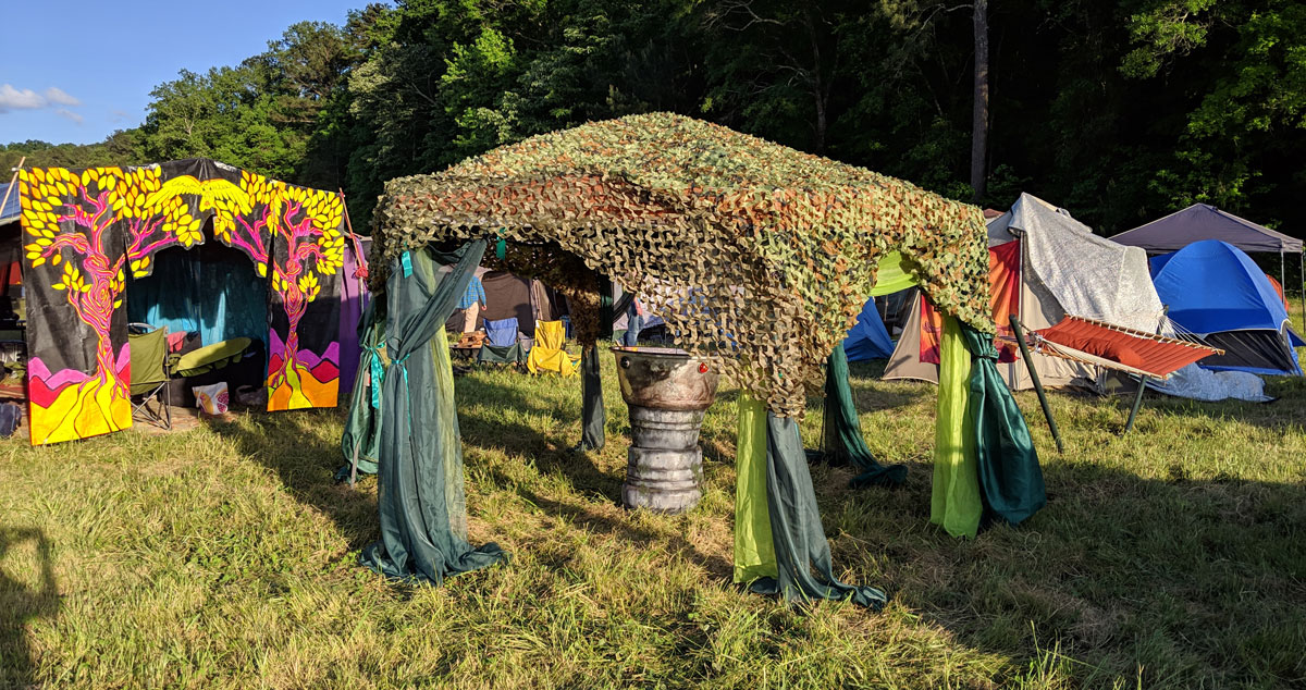 scrying mirror during the day with green canopy and green curtains in the sun
